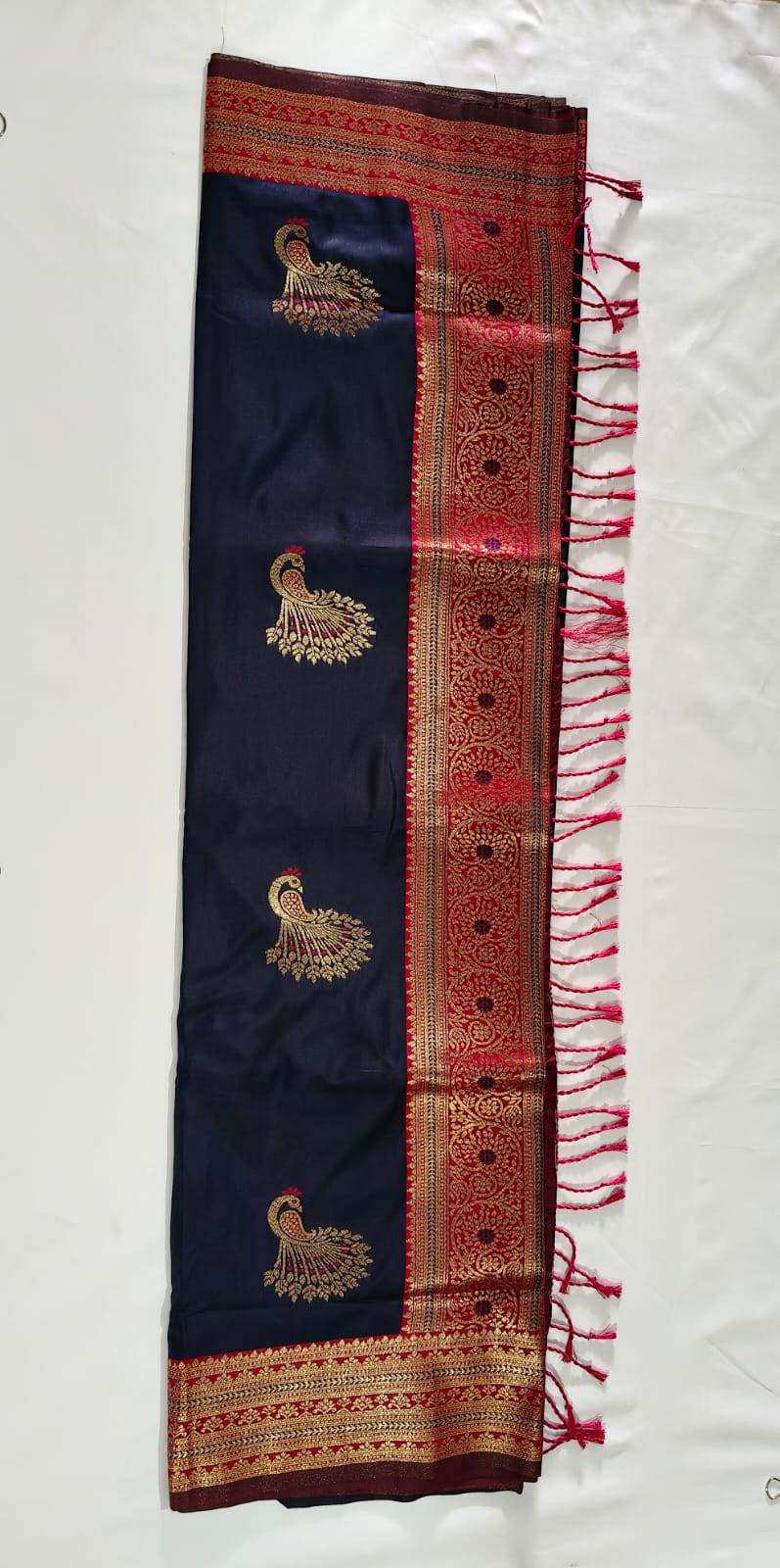 Elegant Navy Blue Banarasi Silk with Royal Red border and Intricate Gold Zari Peacock Weaving