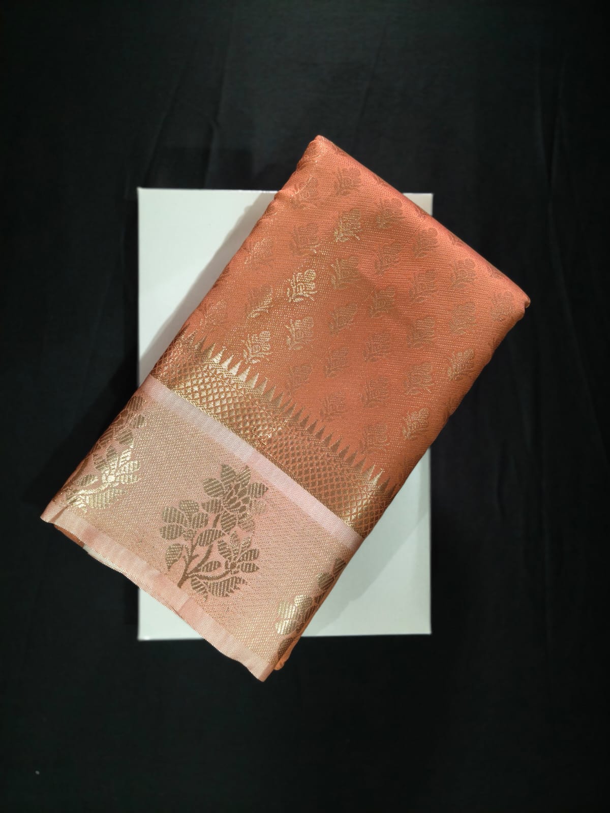 Delicate Peach Silk adorned with All-Over Gold Zari Bootas and a Brocade Border