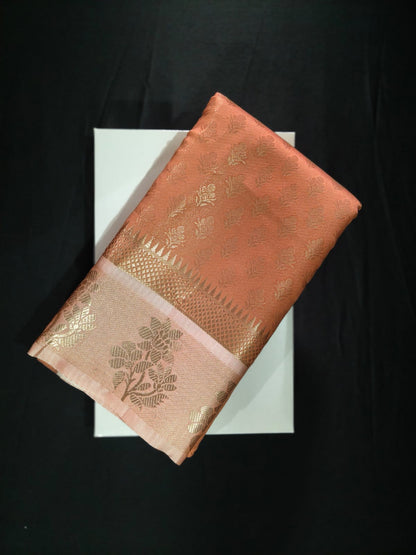 Delicate Peach Silk adorned with All-Over Gold Zari Bootas and a Brocade Border
