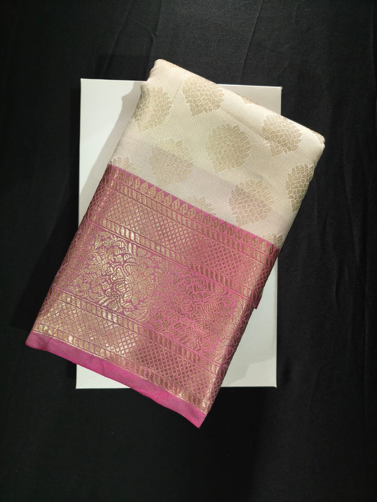 Elegant Off-White Silk with Subtle Zari Motifs and a Bold Magenta Brocade Border
