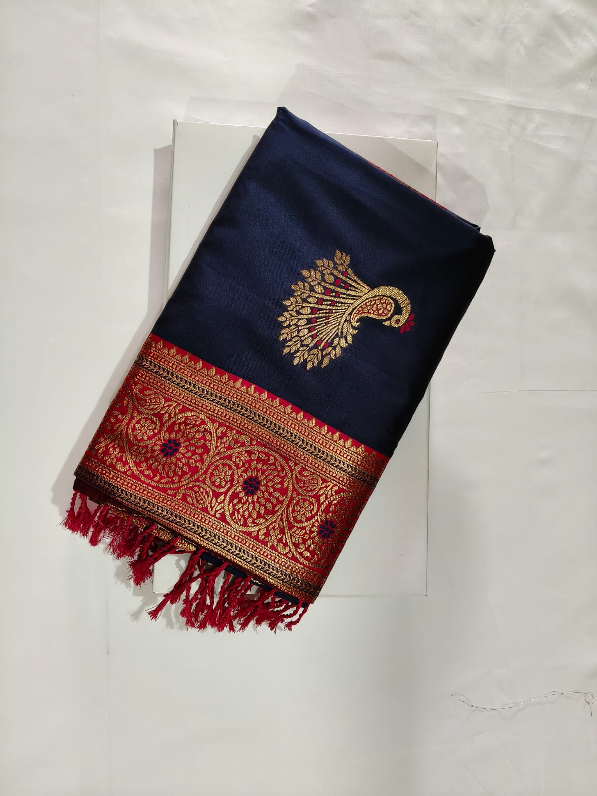 Elegant Navy Blue Banarasi Silk with Royal Red border and Intricate Gold Zari Peacock Weaving