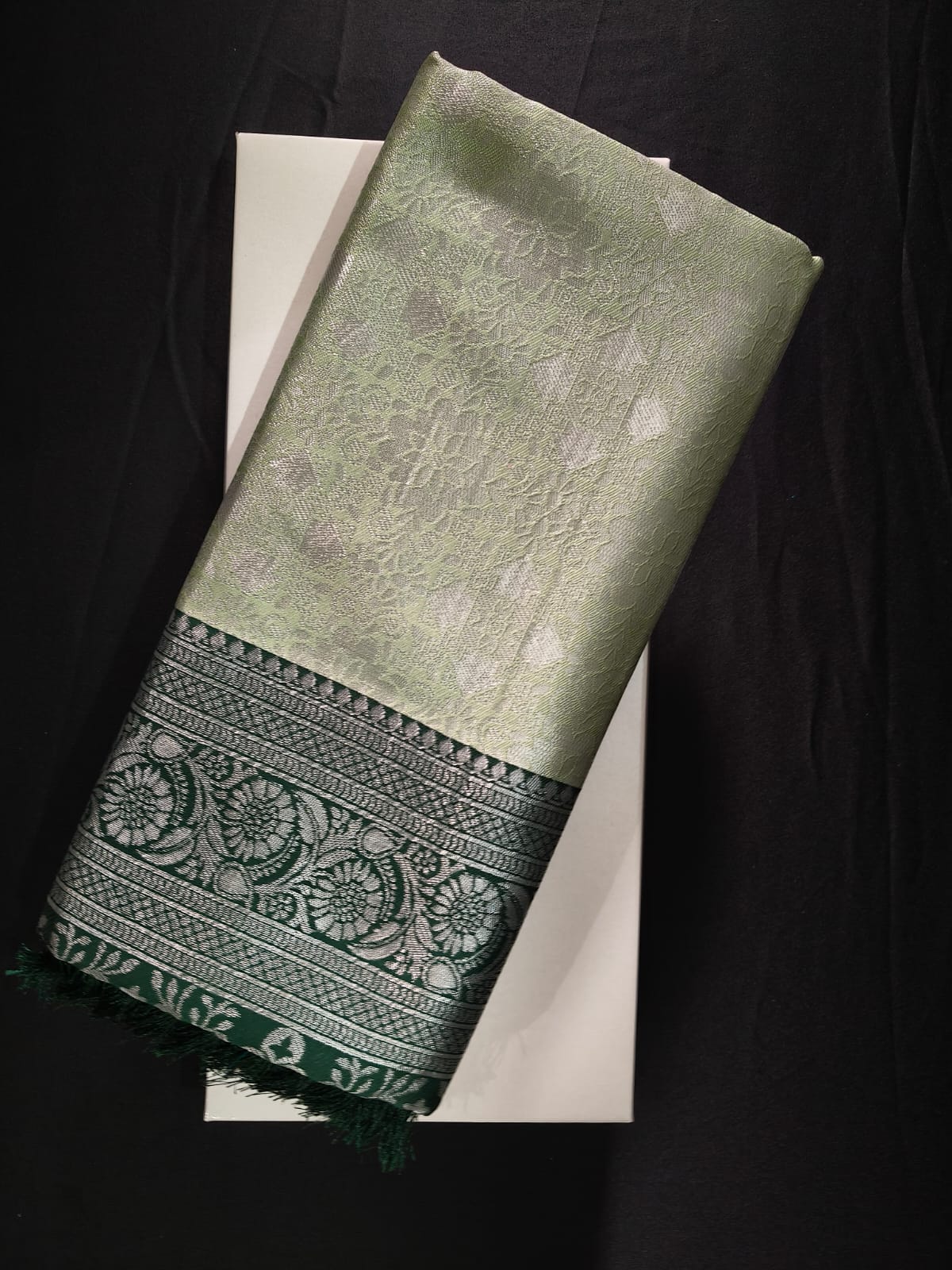 Soft Green Kasturi Silk with a Deep Forest Green Border with Heavy Silver Zari Work