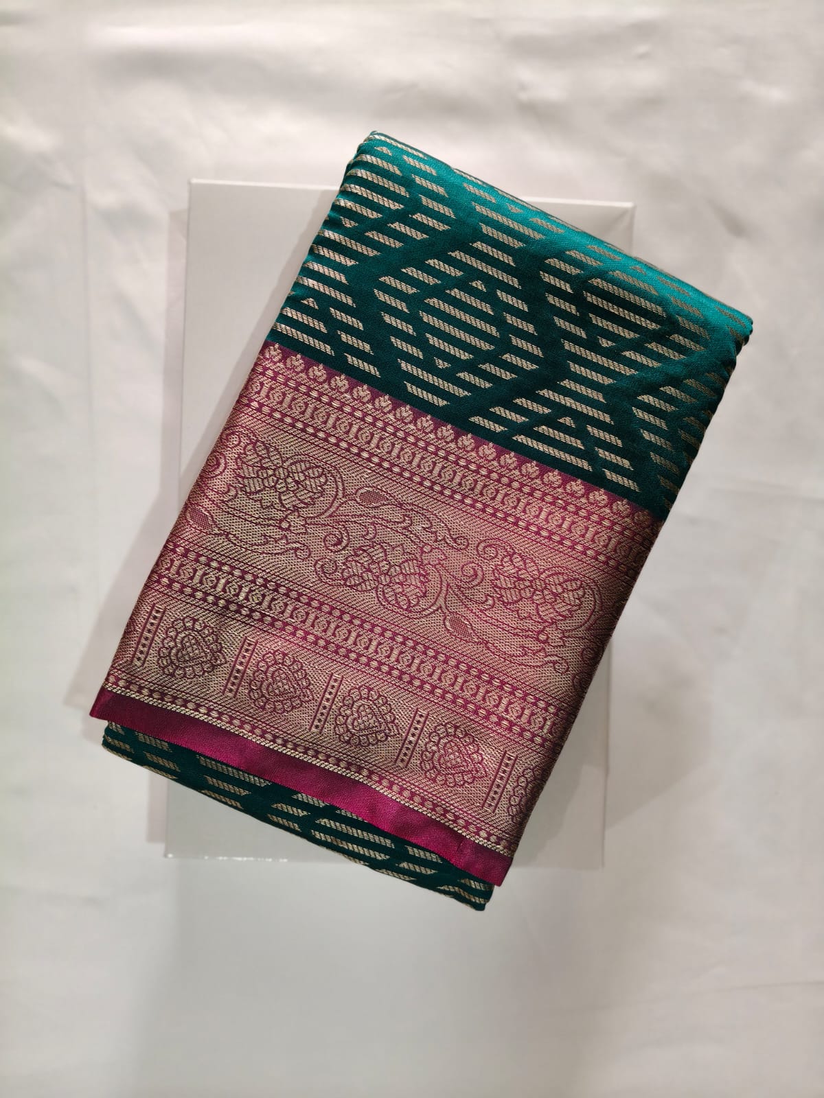 Striking Teal Green Silk with Gold Zari Geometric Body Weave and a Rich Maroon Border with Intricate Paisley Motifs