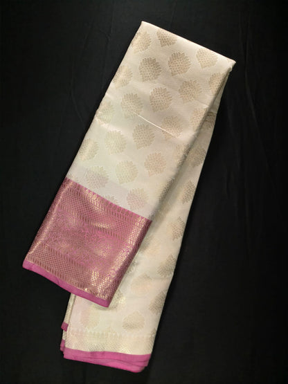 Elegant Off-White Silk with Subtle Zari Motifs and a Bold Magenta Brocade Border