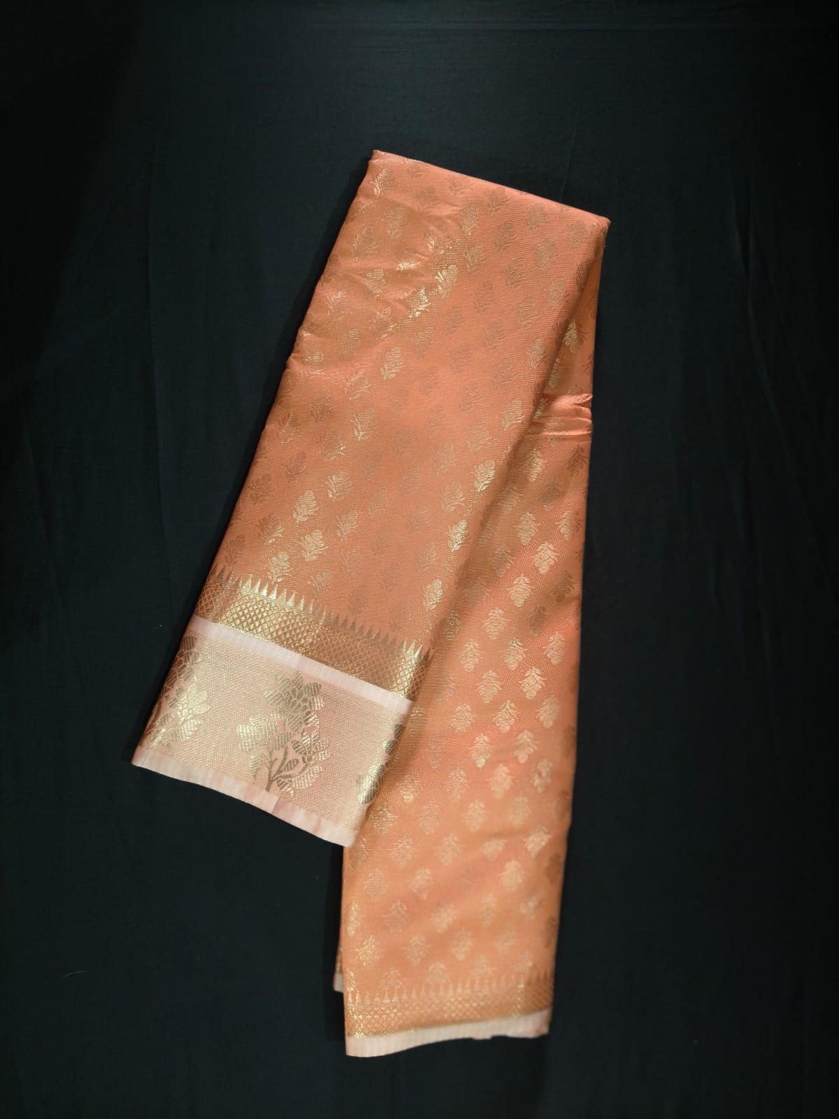 Delicate Peach Silk adorned with All-Over Gold Zari Bootas and a Brocade Border