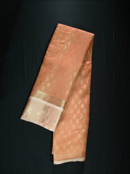 Delicate Peach Silk adorned with All-Over Gold Zari Bootas and a Brocade Border